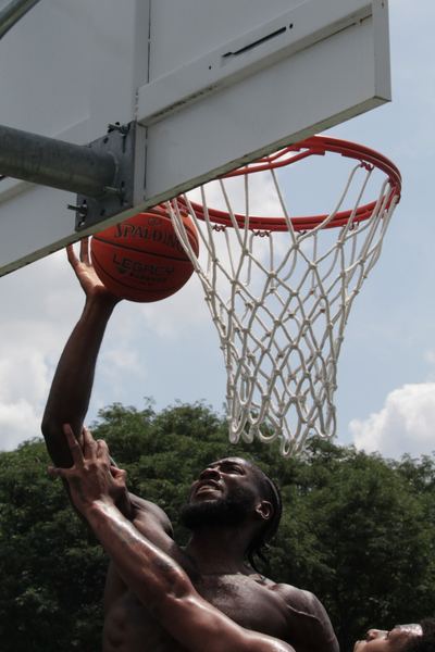 Player going up for a dunk at Beast of the Blacktop