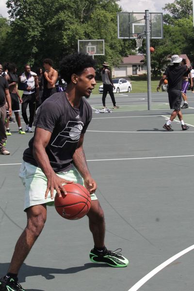 Player dribbling on the blacktop